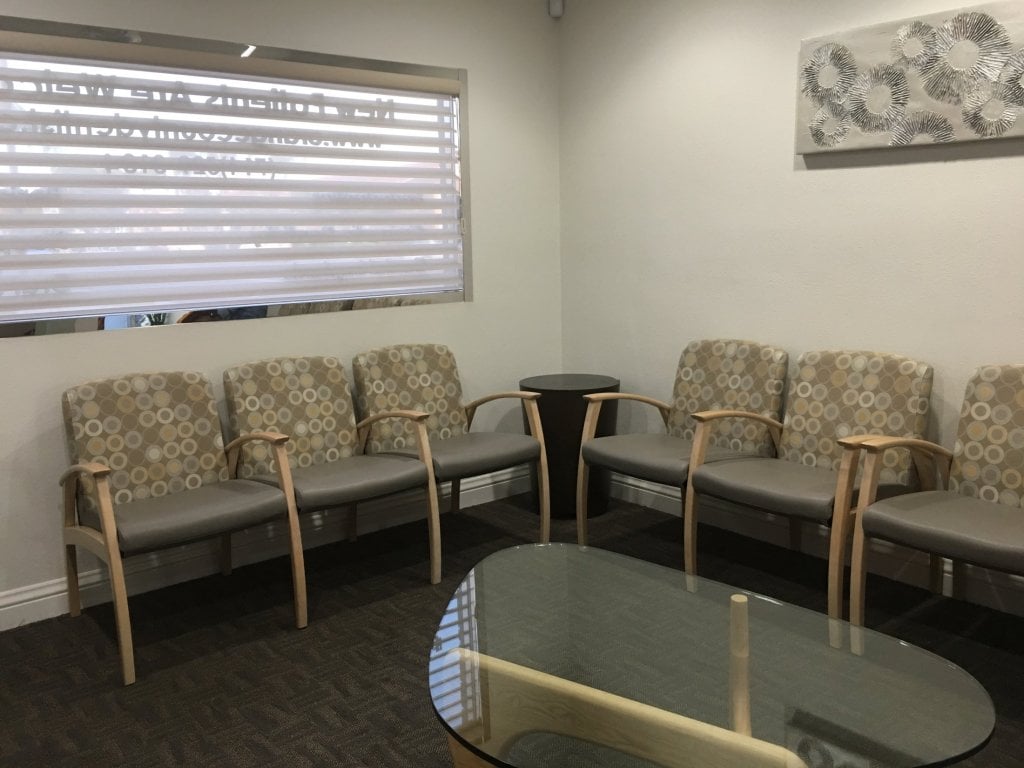 waiting area with chairs and a desk